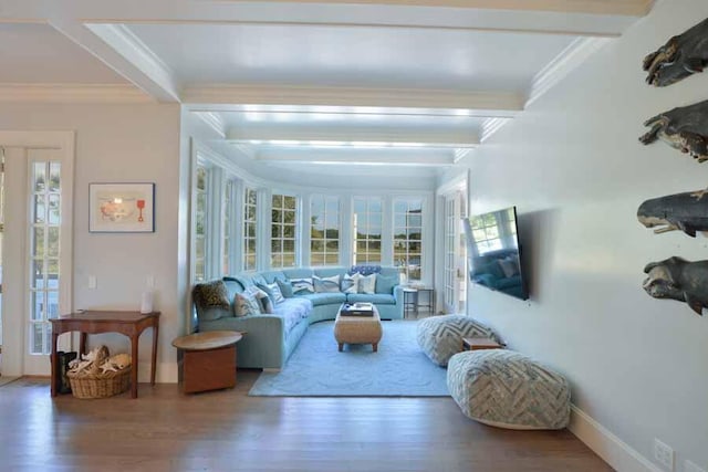 living room featuring ornamental molding, hardwood / wood-style floors, and beam ceiling