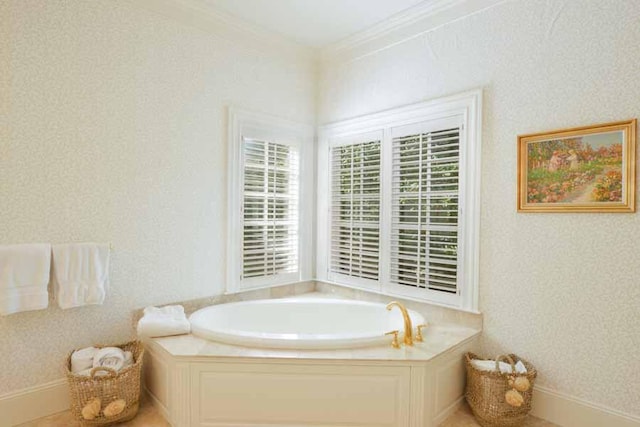 bathroom featuring crown molding and a tub