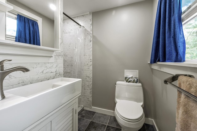 215 Head Of The Bay Rd, Buzzards Bay, MA 02532 - full bath with toilet, baseboards, vanity, and a shower with shower curtain