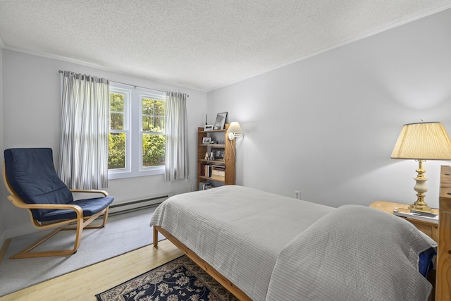 215 Head Of The Bay Rd, Buzzards Bay, MA 02532 - bedroom featuring wood finished floors, a textured ceiling, a baseboard radiator, and crown molding