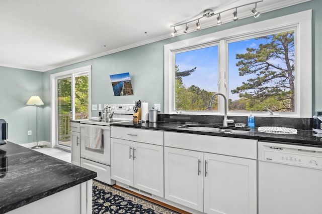 215 Head Of The Bay Rd, Buzzards Bay, MA 02532 - kitchen featuring white appliances, a sink, white cabinetry, dark stone countertops, and ornamental molding