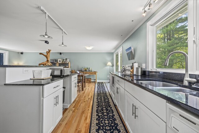 215 Head Of The Bay Rd, Buzzards Bay, MA 02532 - kitchen featuring a sink, track lighting, white cabinetry, and light wood-style flooring
