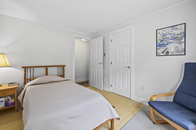 215 Head Of The Bay Rd, Buzzards Bay, MA 02532 - bedroom with light wood finished floors and crown molding