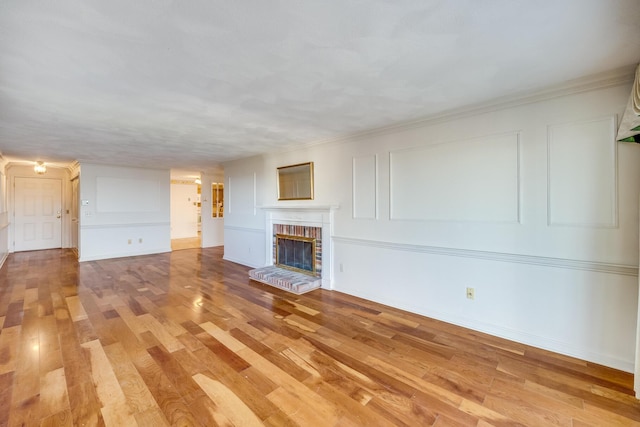 33 Highview Dr, Sandwich, MA 02563 - unfurnished living room with a brick fireplace and light wood-type flooring