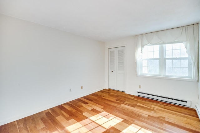33 Highview Dr, Sandwich, MA 02563 - unfurnished room with baseboards, wood finished floors, and a baseboard radiator