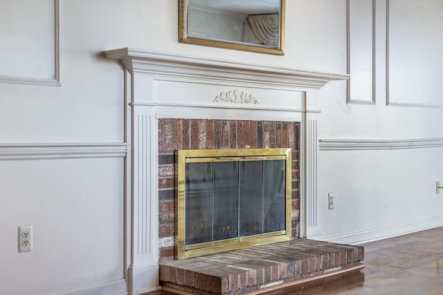 33 Highview Dr, Sandwich, MA 02563 - details featuring a brick fireplace and wood finished floors