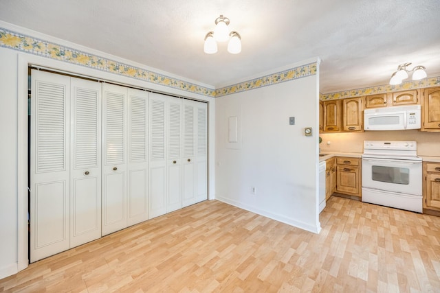 33 Highview Dr, Sandwich, MA 02563 - kitchen with light wood-style floors, light countertops, baseboards, and white appliances