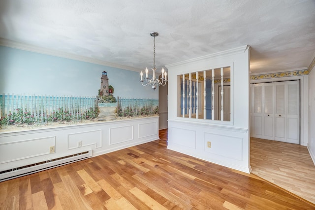33 Highview Dr, Sandwich, MA 02563 - unfurnished dining area featuring crown molding, a decorative wall, light wood-style floors, baseboard heating, and a notable chandelier