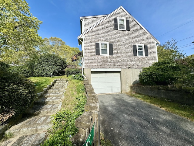 view of property exterior featuring a garage