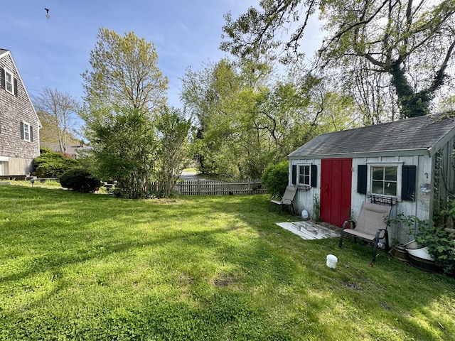 view of yard featuring a storage unit