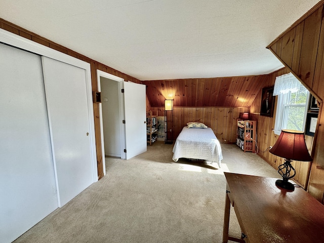 unfurnished bedroom with light colored carpet and a closet