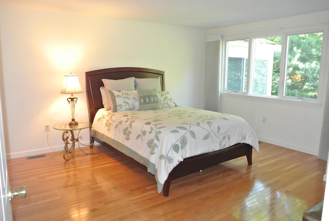 bedroom featuring wood-type flooring