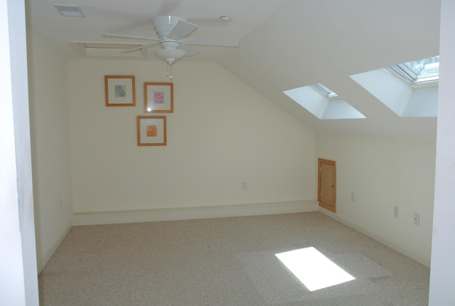 bonus room with ceiling fan, light carpet, and vaulted ceiling