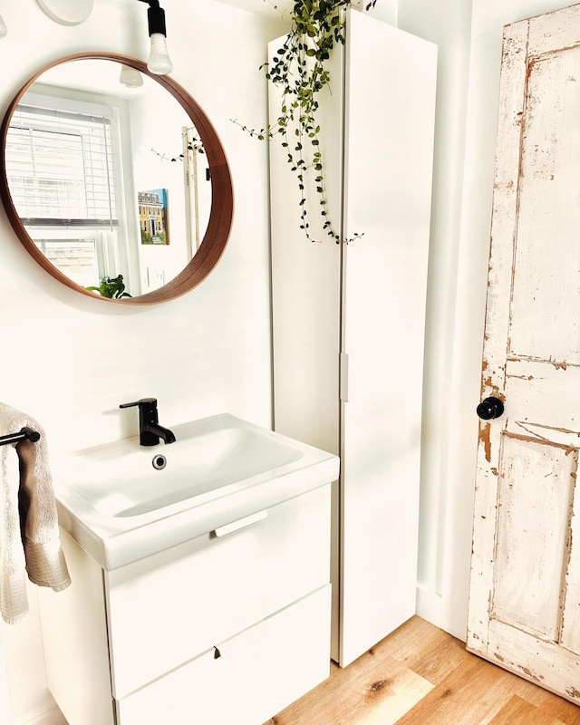 476 Commercial St Unit 4, Provincetown, MA 02657 - bathroom featuring wood finished floors and vanity