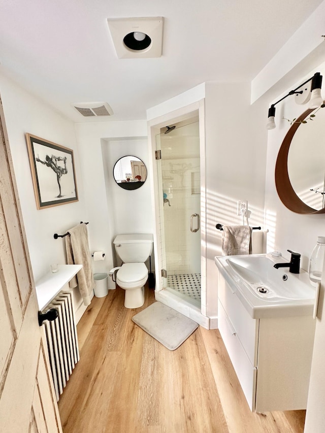 476 Commercial St Unit 4, Provincetown, MA 02657 - bathroom featuring vanity, wood finished floors, and a stall shower