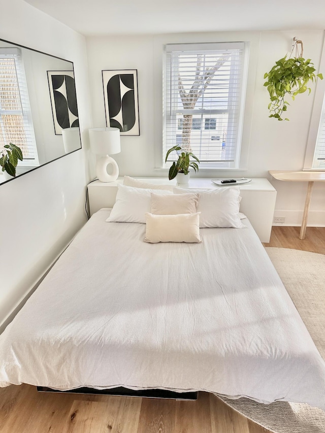 476 Commercial St Unit 4, Provincetown, MA 02657 - bedroom with wood finished floors