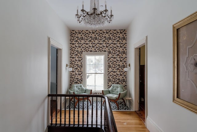115 Rte 28, West Harwich, MA 02671 - bedroom featuring light wood-style flooring, baseboards, and an inviting chandelier