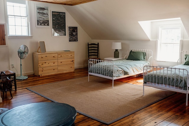 115 Rte 28, West Harwich, MA 02671 - bedroom featuring lofted ceiling, multiple windows, baseboards, and wood-type flooring