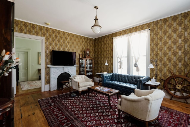 115 Rte 28, West Harwich, MA 02671 - living area with hardwood / wood-style flooring, ornamental molding, a fireplace, and wallpapered walls