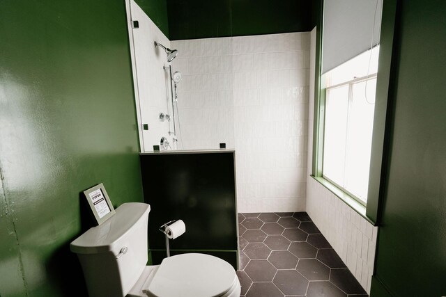 115 Rte 28, West Harwich, MA 02671 - bathroom with tile patterned floors, toilet, and tiled shower