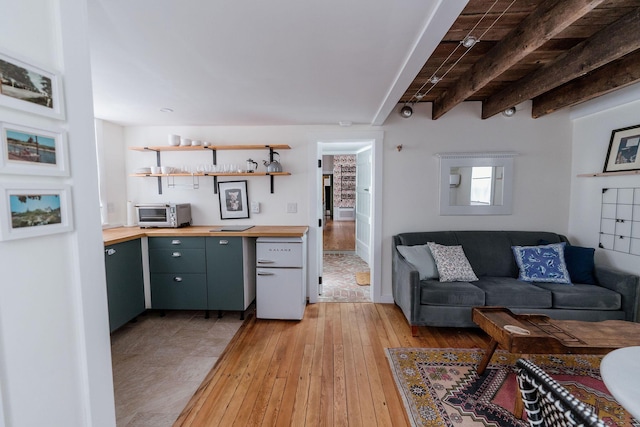 115 Rte 28, West Harwich, MA 02671 - living area with beamed ceiling, light wood-style floors, and a toaster