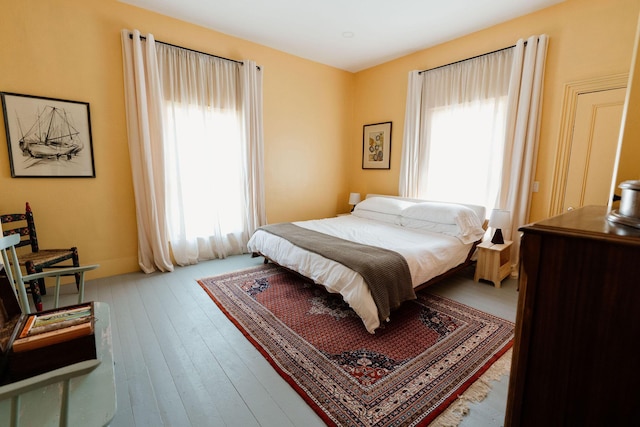 115 Rte 28, West Harwich, MA 02671 - bedroom featuring multiple windows and hardwood / wood-style floors