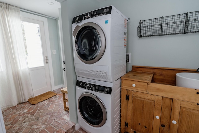 115 Rte 28, West Harwich, MA 02671 - laundry area featuring laundry area, stacked washer and dryer, and brick floor
