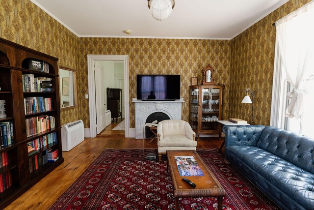 115 Rte 28, West Harwich, MA 02671 - living area featuring a fireplace, wallpapered walls, crown molding, and wood finished floors