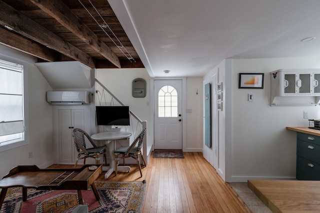 115 Rte 28, West Harwich, MA 02671 - foyer with baseboards, light wood-type flooring, and a wall mounted AC