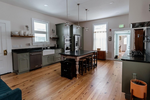 115 Rte 28, West Harwich, MA 02671 - kitchen with open shelves, gray cabinets, stainless steel appliances, light wood-style floors, and dark countertops