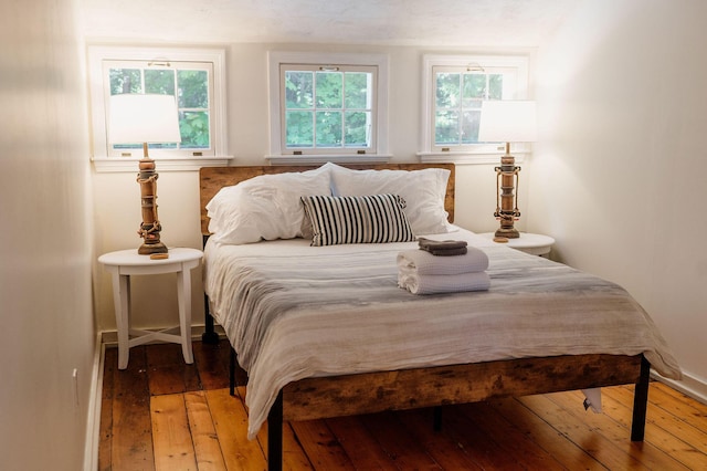 115 Rte 28, West Harwich, MA 02671 - bedroom featuring multiple windows and wood-type flooring