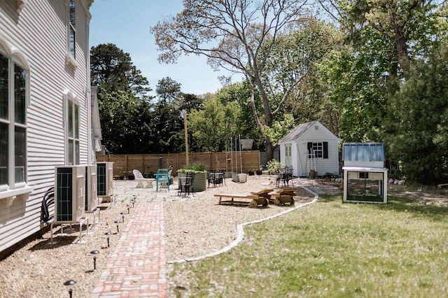 115 Rte 28, West Harwich, MA 02671 - view of yard featuring a patio area, an outdoor structure, and fence
