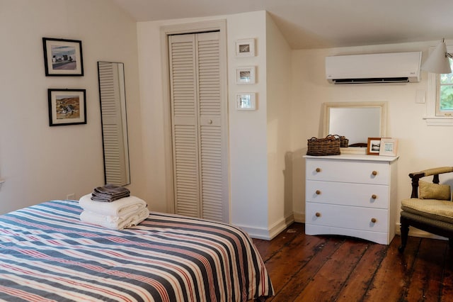 115 Rte 28, West Harwich, MA 02671 - bedroom featuring dark wood-style floors, baseboards, lofted ceiling, an AC wall unit, and a closet