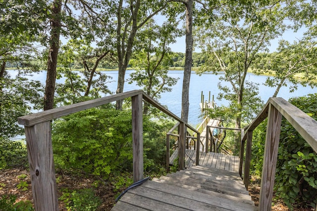 wooden terrace with a water view