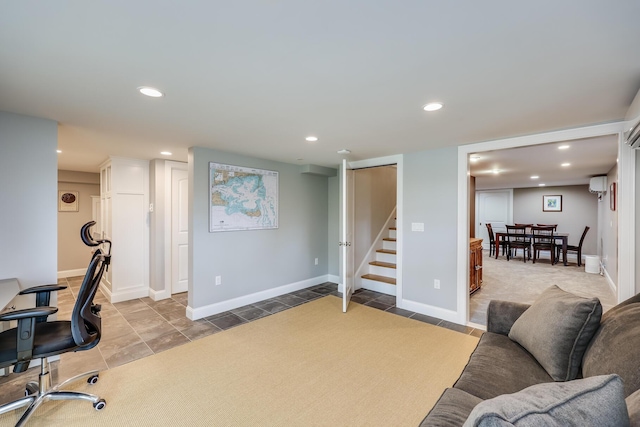 interior space with baseboards, stairway, and recessed lighting