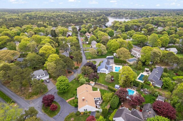8 Viking Rock Rd, South Yarmouth, MA 02664 - aerial perspective of suburban area with a nearby body of water, a forest, and a pool area