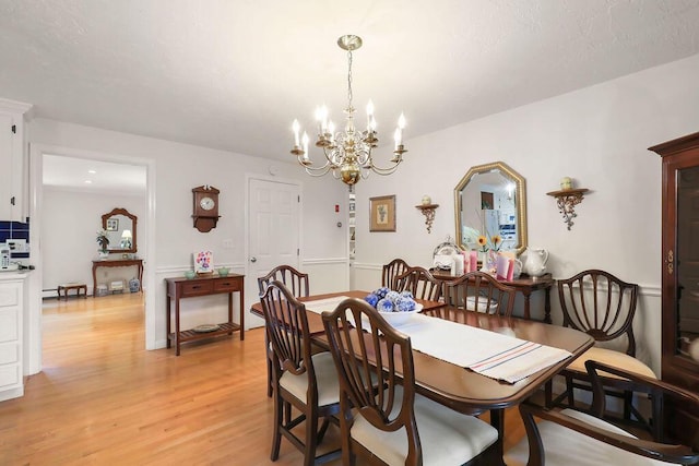 8 Viking Rock Rd, South Yarmouth, MA 02664 - dining room with a chandelier and light wood-type flooring