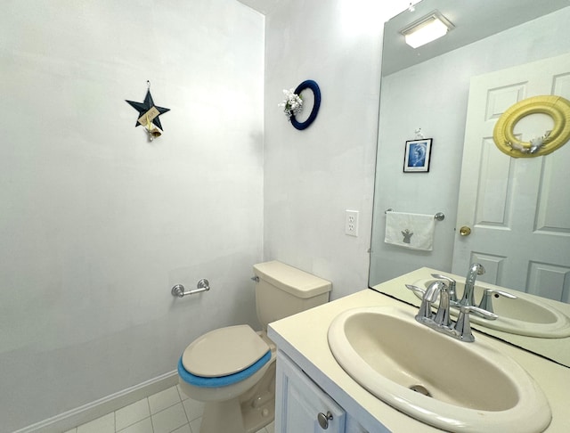 bathroom featuring vanity, toilet, and tile patterned flooring