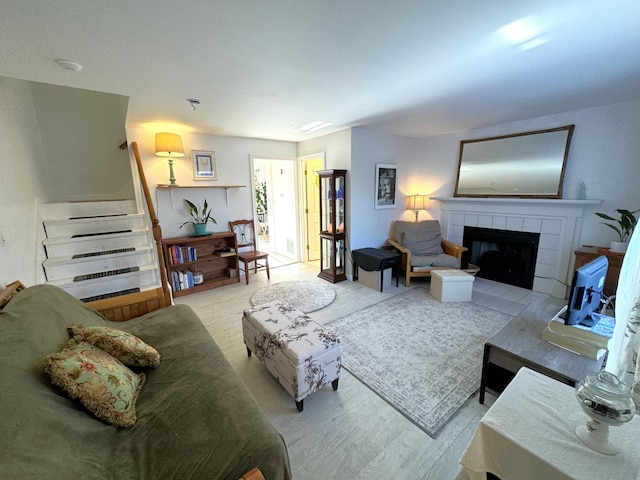 living room featuring light hardwood / wood-style floors and a fireplace