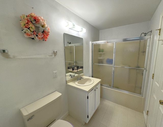 full bathroom featuring toilet, enclosed tub / shower combo, and vanity