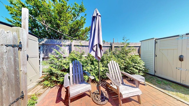 view of patio with a shed