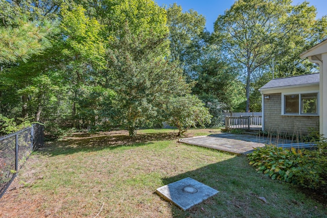 view of yard with a wooden deck