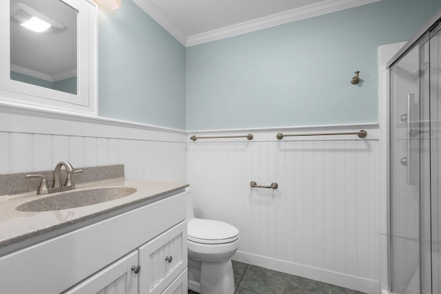 bathroom featuring tile patterned floors, ornamental molding, toilet, a shower with shower door, and vanity