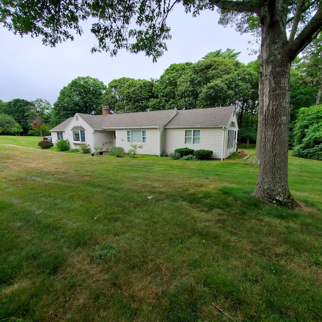 ranch-style home with a front yard