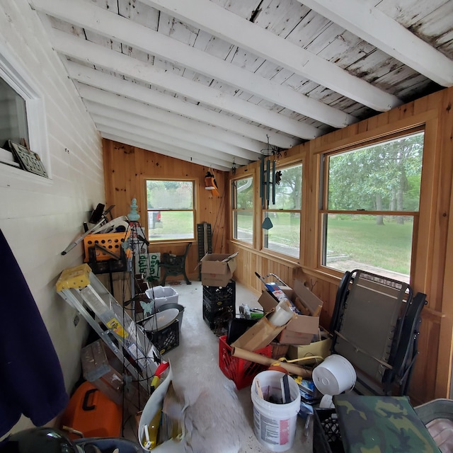 sunroom / solarium featuring a wealth of natural light and vaulted ceiling with beams