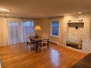 dining area with hardwood / wood-style flooring