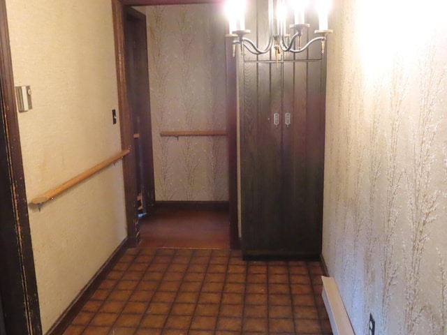 corridor featuring an inviting chandelier