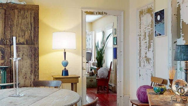 dining area featuring a baseboard heating unit