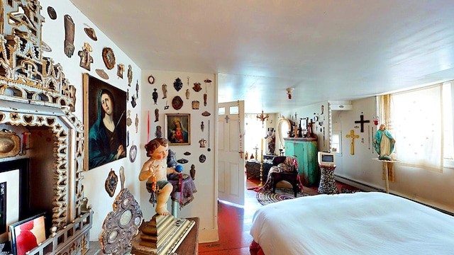 bedroom with an AC wall unit