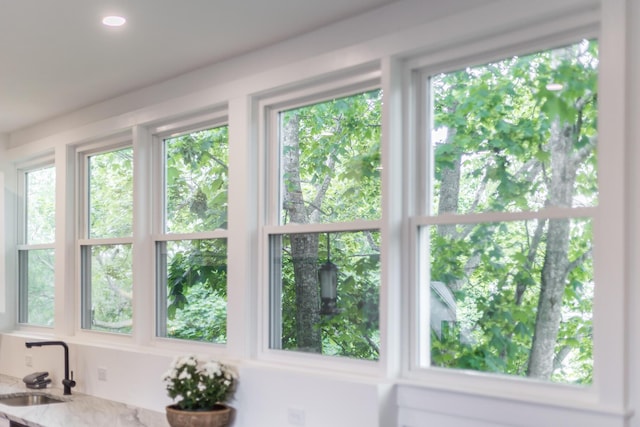 36 Pearl St Unit 3, Provincetown, MA 02657 - detailed view of a sink, light stone counters, and recessed lighting